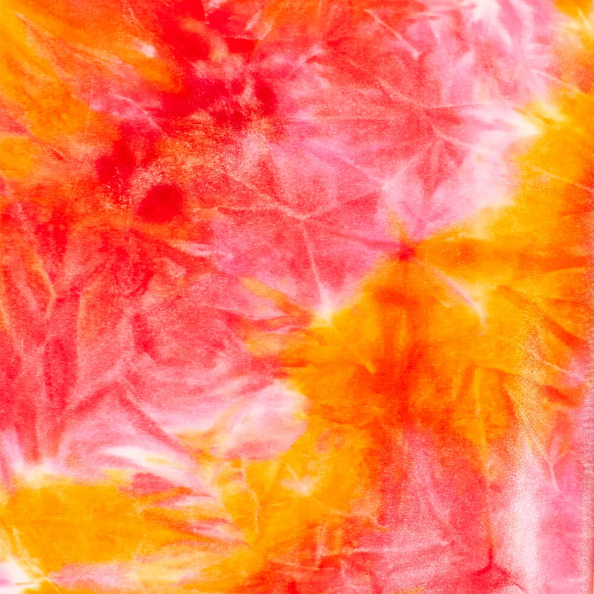 Close-up of tie-dye fabric with pink, orange, and white colors.