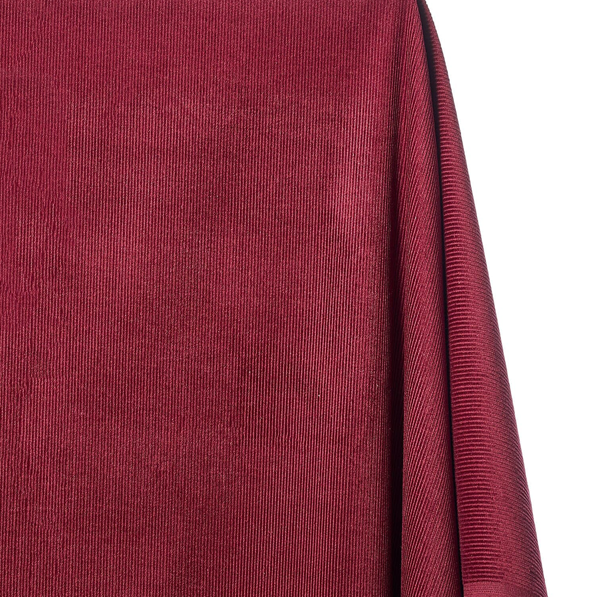 Close-up of a textured red fabric with a white background