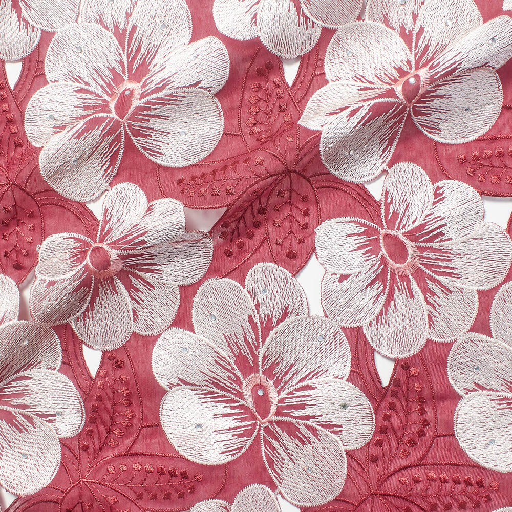 A piece of rose red fabric with white floral and leaf embroidery patterns| beautiful Windows Elgin