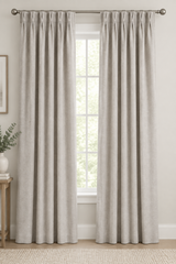 Grey pinch pleat curtain panel with 5-inch header
