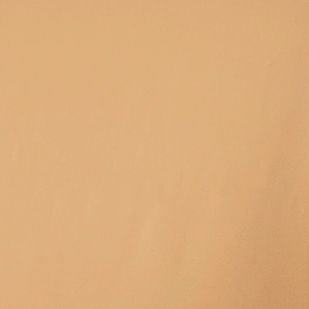 A swatch of nude-colored tricot fabric with a matte finish.