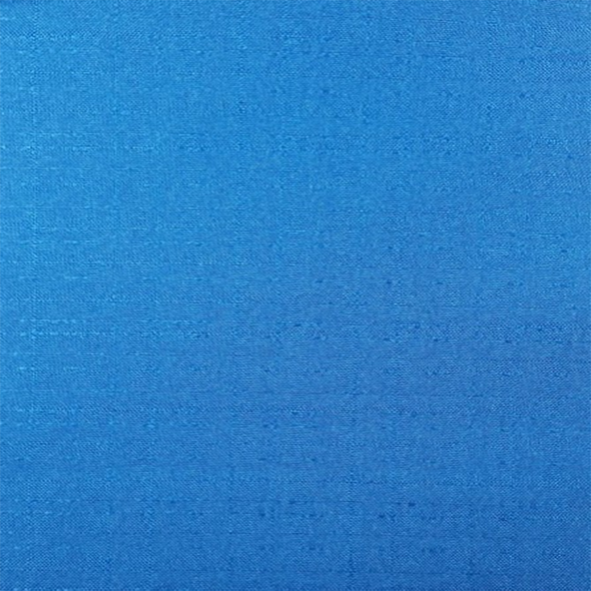 A solid blue colored curtain panel with a textured pattern| Beautiful Windows Elgin