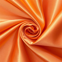 Marisol Orange—Charmeuse Satin—Lustrous Finish on Front—100% Polyester—Width (58/59 Inches)—Available by the Yard