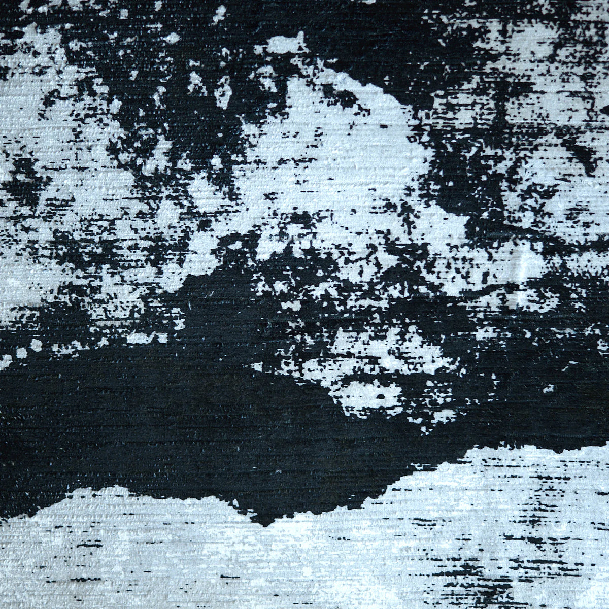 Close-up of a black and white patterned fabric with a visible texture, likely a tuxedo stripe design| Sold by Beautiful Windows Elgin