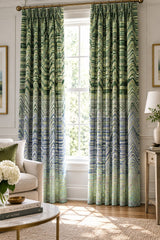A close-up of a woven fabric with a repeating chevron pattern in shades of green, blue, beige, and white.