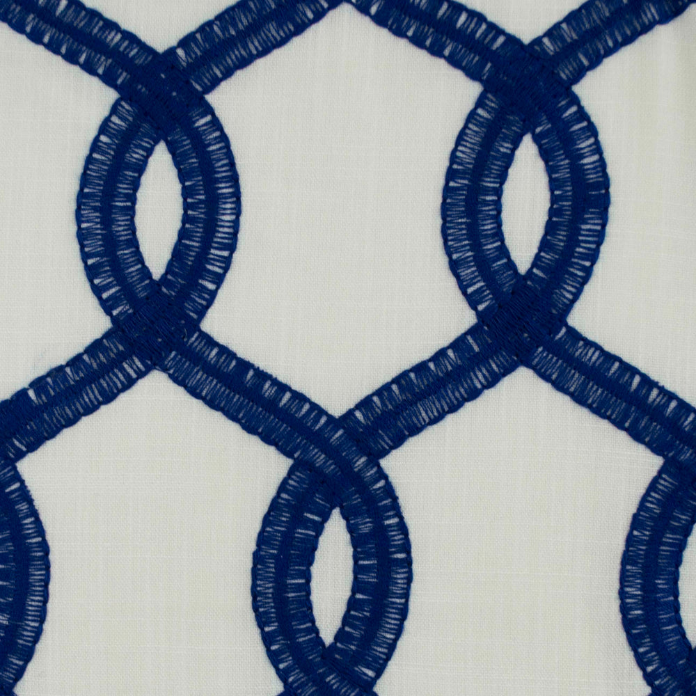 Close-up of Nantucket blue and white drapery fabric showcasing the embossed pattern and texture.