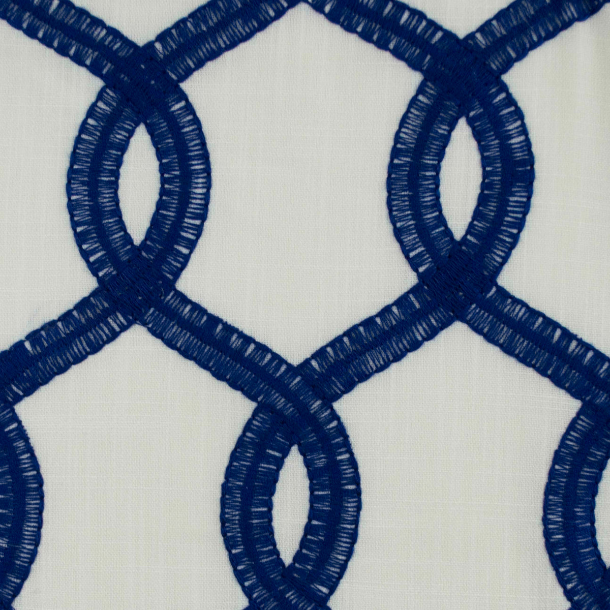 Close-up of Nantucket blue and white drapery fabric showcasing the embossed pattern and texture.